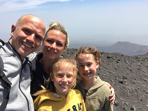 Family on the volcano Mount Etna (Sicily)